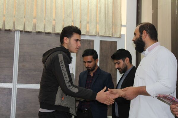 آیین تجلیل از برگزیدگان پسر مسابقات قرآن، عترت و نماز شهرستان بن 