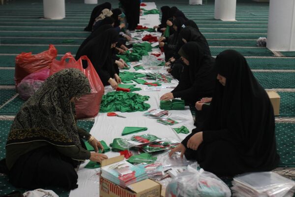 بسته‌بندی لباس همایش شیرخوارگان حسینی زنجان