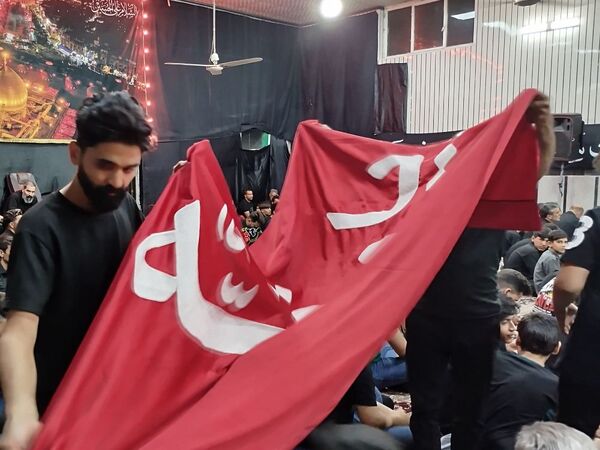 مراسم پرچم گردانی در حسینیه حسینی روستای رزق آباد شهرستان کاشمر