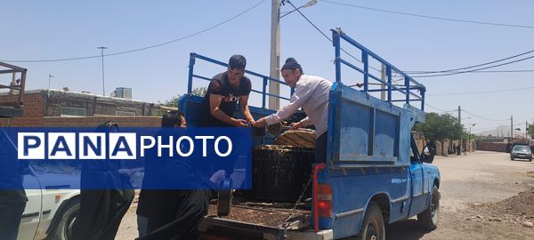 پخش نذری ظهر عاشورا در روستای حسن آباد بلهر 