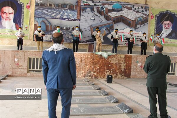 غبارروبی گلزار شهدا توسط دانش آموزان