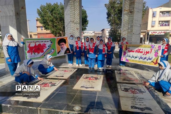 غبارروبی وعطرافشانی مزار شهدای شادگان