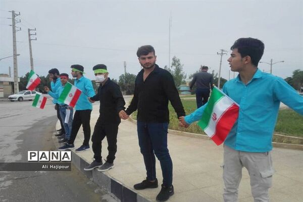 زنجیره انسانی هنرجویان هنرستان سعادت شبانکاره  بوشهر  در پی حمایت از سپاه پاسداران انقلاب اسلامی ایران