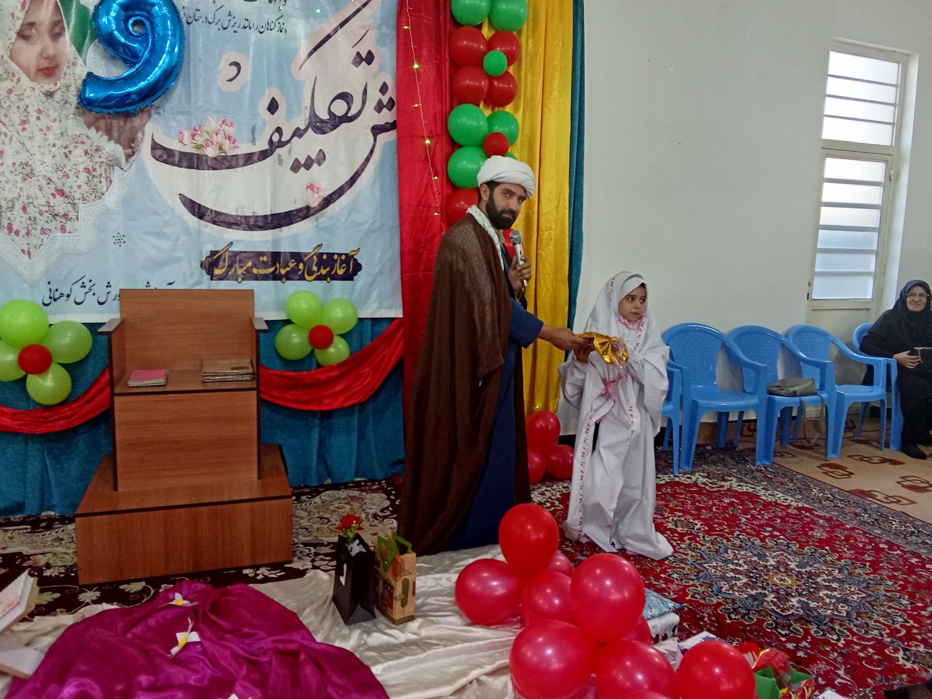 برگزاری مراسم معنوی جشن تکلیف دانش‌آموزان پایه سوم در حسینیه منطقه کوهنانی 