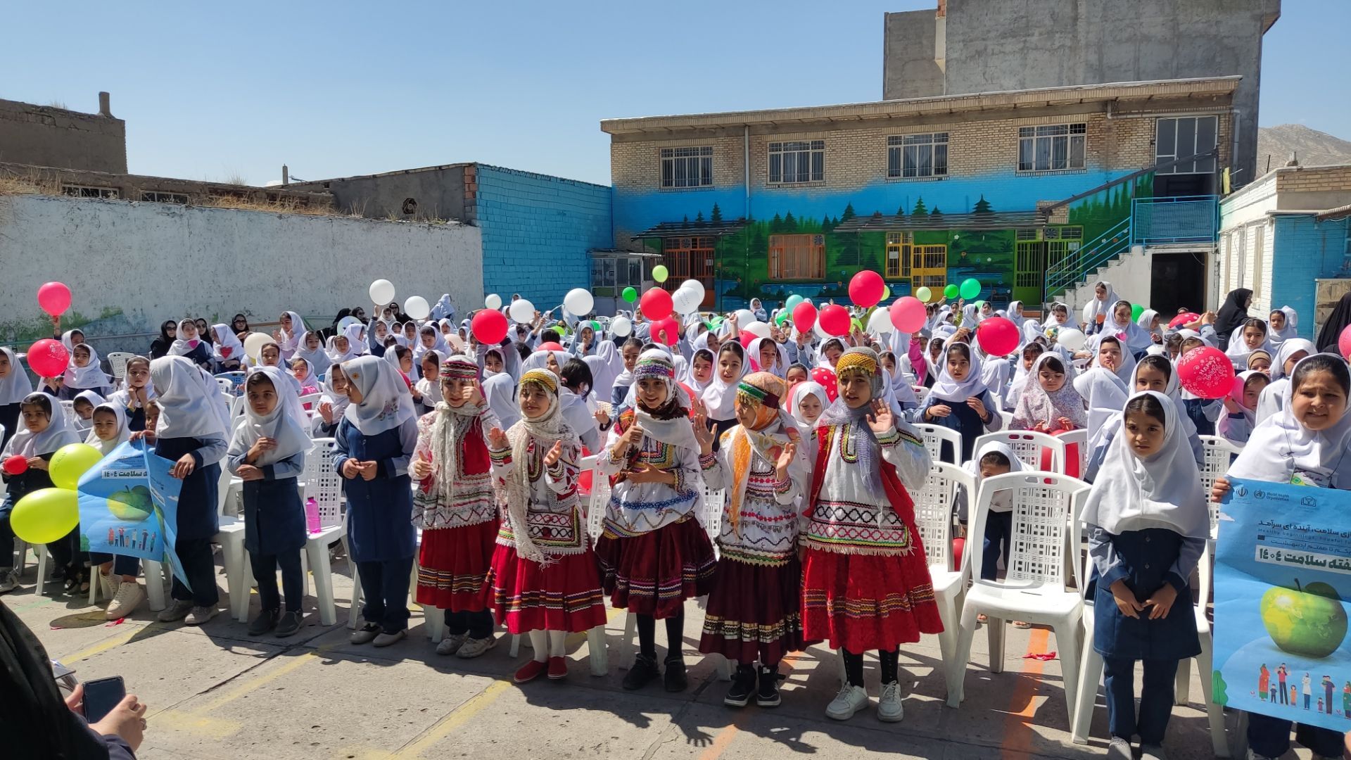 نواختن زنگ سلامت در مدرسه دخترانه ضحی ۱ شهرستان شیروان