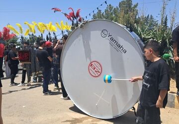 عزاداری ظهر عاشورا در روستای ولیان ساوجبلاغ