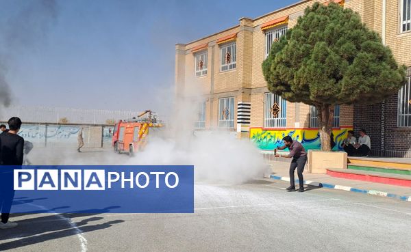 آیین نواختن زنگ پدافند غیرعامل در زاوه